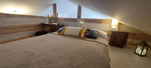 a bedroom with a large bed in a attic at Stunning view-Maleni in Vis