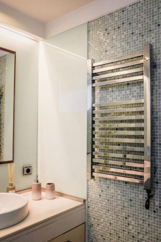 a bathroom with a sink and a shower at Marlages House in Lavra
