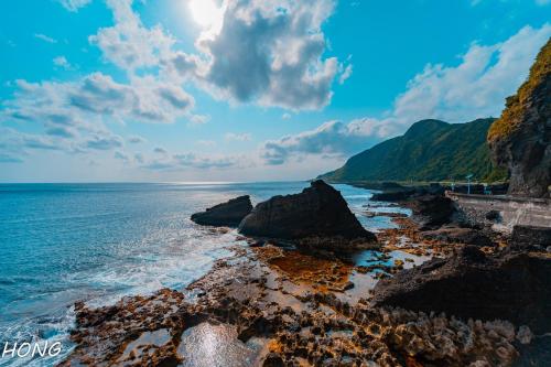 a view of the ocean from a rocky beach at 歸海Back to the Ocean in Green Island