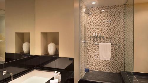 a bathroom with a sink and a shower at Snowmass Viceroy 1 Bedroom Residence in Snowmass Village