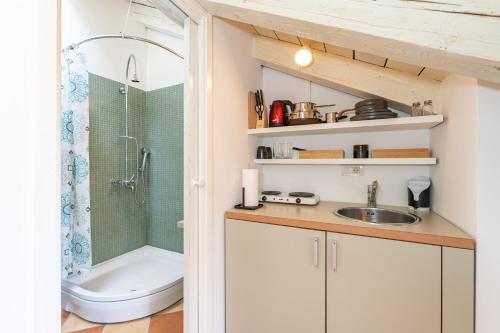 a bathroom with a toilet and a sink and a shower at Kenova Apartments Old Town in Dubrovnik