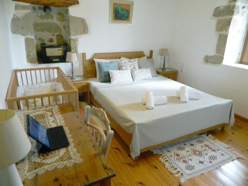 A bed or beds in a room at Villa Venetico stone retreat with garden