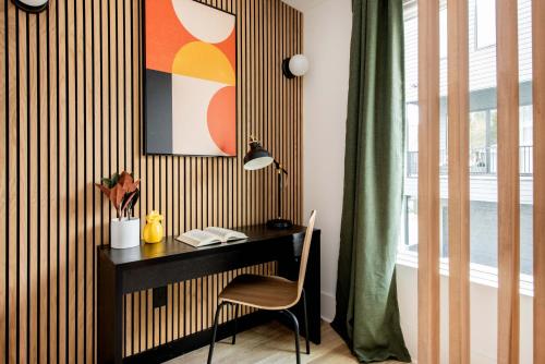 a desk with a chair next to a window at Champagne Wishes in Atlanta