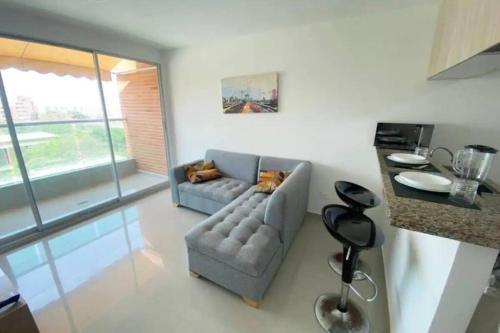 Zona de estar de Cozy duplex with balcony, pool and great location