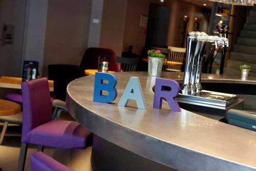 a bar with a bar sign on a counter at Campanile Lyon Centre - Gare Perrache - Confluence in Lyon