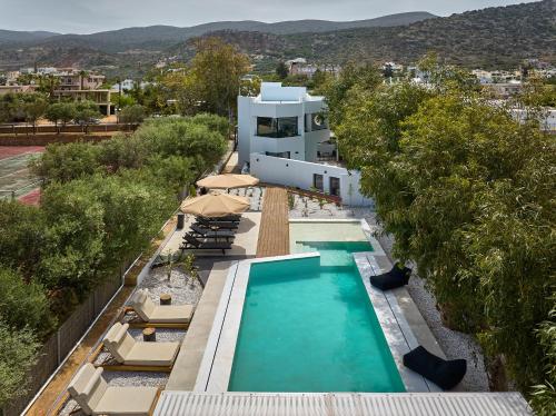 an aerial view of a house with a swimming pool at MichELe Luxury apartments by Smaris Collection in Malia