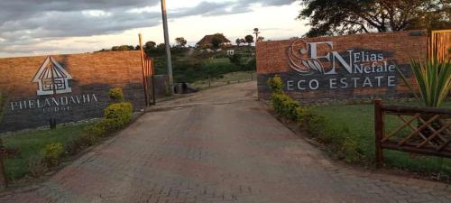 a sign for the el paso eco estate at Elias Nefale Eco Estate in Mitxetweni