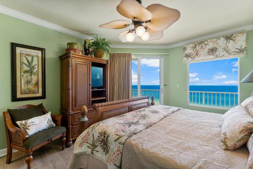 a bedroom with a bed and a fan at Beachfront Bliss Luxe 3BR Condo at Marisol Complex in Panama City Beach