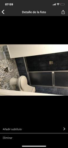 a picture of a bathroom with a toilet at Miraflores Efficiency in Lima