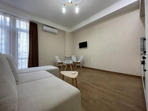 a living room with a couch and a table at Amiryan 4, No 28 in Yerevan