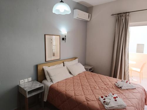 Ένα ή περισσότερα κρεβάτια σε δωμάτιο στο Miramare Apartments 