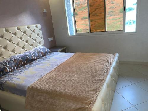 Postel nebo postele na pokoji v ubytování Apartamentos Palace Rif Al Hoceima