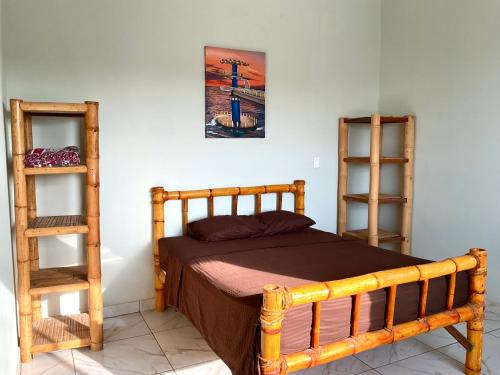 Ένα ή περισσότερα κρεβάτια σε δωμάτιο στο Casa de Hamacas