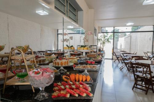 a buffet line with desserts and fruit on display at Havana Express in Uberaba