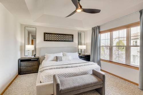 a bedroom with a bed and a ceiling fan at Luxury Prairie Retreat 5 Min from Madison! in Sun Prairie