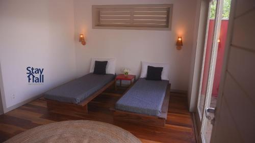 Ένα ή περισσότερα κρεβάτια σε δωμάτιο στο Retiro sereno c Piscina-Casa Manga-4 quartos-085M