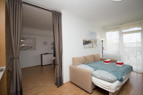Ένα ή περισσότερα κρεβάτια σε δωμάτιο στο Beach Apartman