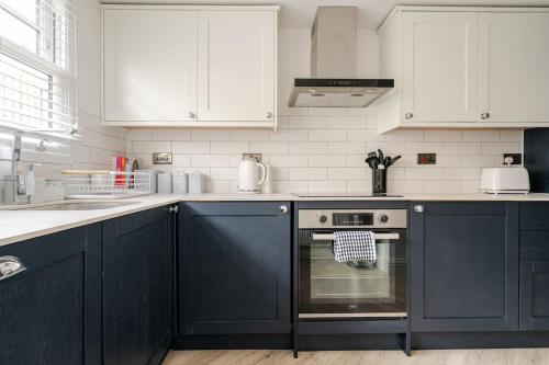 A cozinha ou cozinha compacta de The Snug Den