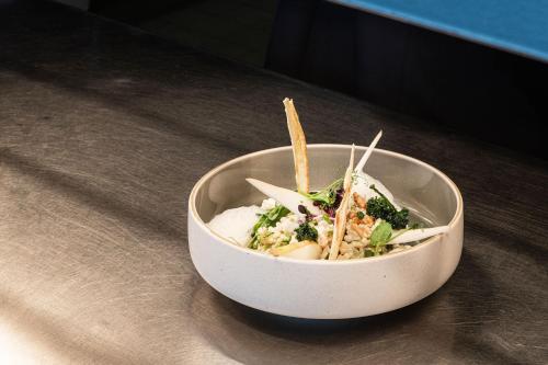 a bowl of food sitting on top of a table at Sheraton Frankfurt Airport Hotel & Conference Center in Frankfurt/Main