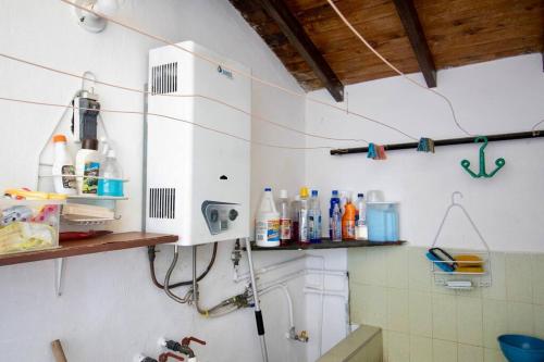 a kitchen with a sink and a white cabinet at Hermosa habitación Las Palmas - Zapatoca in Zapatoca