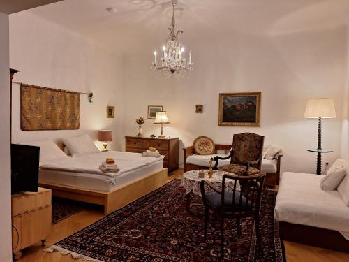 a living room with two beds and a couch at Apartment Altwien in Vienna