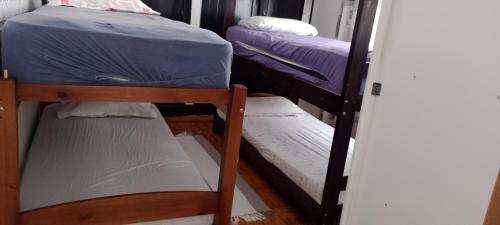 a couple of bunk beds in a room at Rafa's hostel in Sao Paulo