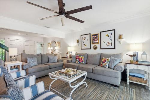 a living room with a couch and a table at 2009 Beach Wood in Amelia Island