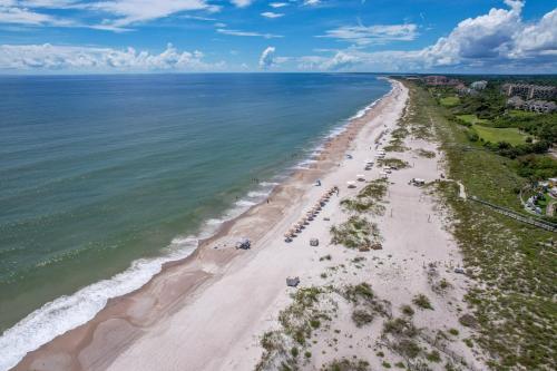 an aerial view of a beach with people on it at 2009 Beach Wood in Amelia Island