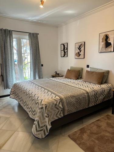 a bedroom with a large bed in a room at Luxury villa in the heart of the city of Marbella Spain. in Marbella