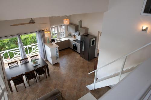 an overhead view of a kitchen and a dining room at Masbango Beach Resort in Jan Thiel