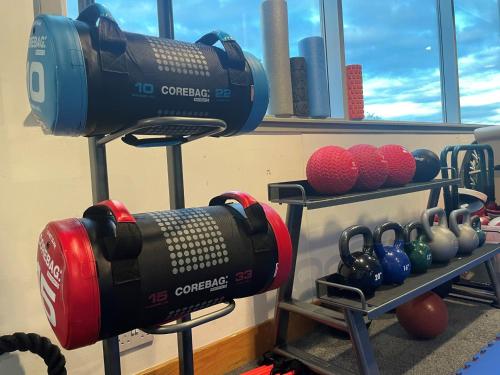 a room with a bunch of boxing equipment at Holiday Inn Edinburgh Zoo by IHG in Edinburgh