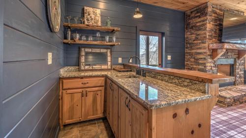a kitchen with a sink and a counter top at Seven Turns to Sunrise in Blue Ridge