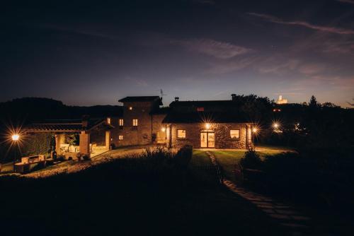 a house at night with lights in front of it at Agriturismo La Dolce Vista in Poppi