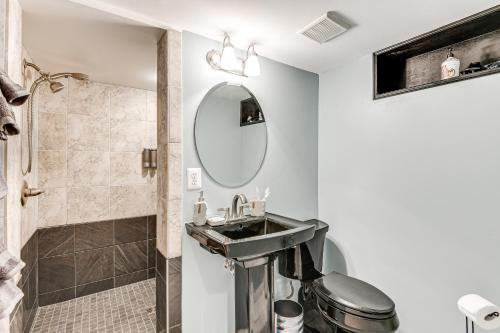 a bathroom with a sink and a shower at Cozy and Pet-Friendly Studio 24 Mi to National Mall in Beltsville