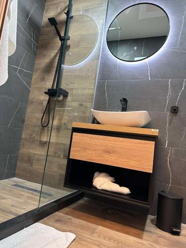 a bathroom with a sink and a mirror at KA apartment Luxury in Stara Zagora