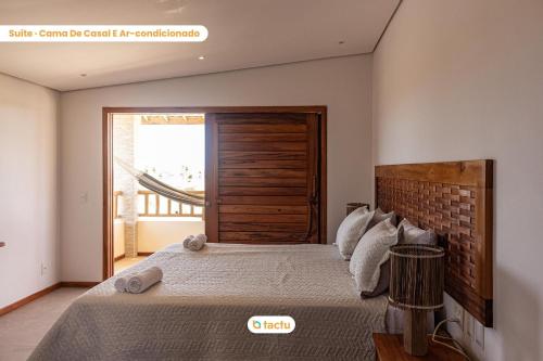 Casa Canoé Fortim Piscina de Luxo em Condomínio tesisinde bir odada yatak veya yataklar