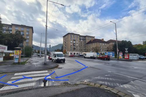 a street with a blue tape on the road at Apartmán BB-Centrum1 in Banská Bystrica