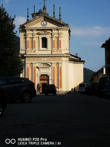a building with a clock tower on top of it at Casa Ethan intero alloggio in Ceres