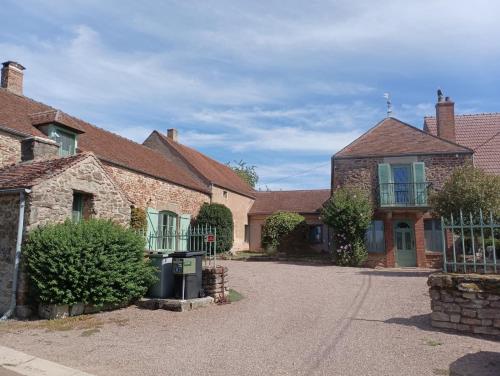 a group of brick houses with a driveway at Mine d'Ore in Thoste