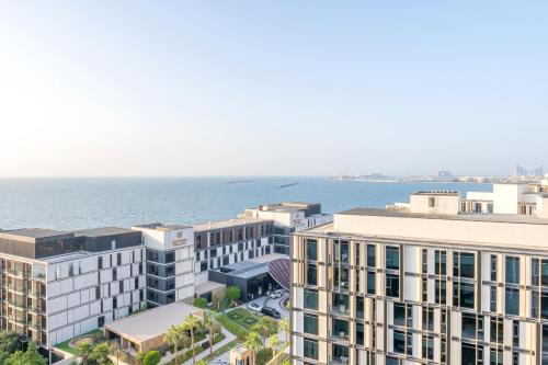 an aerial view of buildings and the ocean at Premium 2+1 BR condo in the heart of Bluewaters Island in Dubai