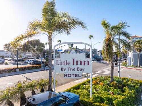 a sign for little inn by the bay hotel at Little Inn By The Bay Newport Beach Hotel in Newport Beach