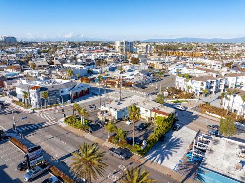 an aerial view of a city with buildings and palm trees at Little Inn By The Bay Newport Beach Hotel in Newport Beach
