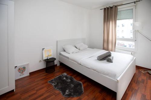 A bed or beds in a room at Charmant appartement au centre