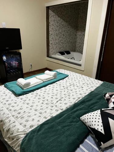 Ένα ή περισσότερα κρεβάτια σε δωμάτιο στο Pousada Rota dos Macacos