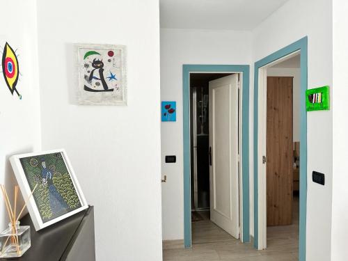 a hallway with an open door and a room with a door at Relaxing Ocean View, Spacious Art Apartment With Large Terrace, Near Best Costa Adeje Beaches in Adeje