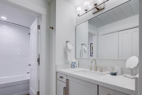 a white bathroom with a sink and a mirror at Luxury Condo & Professional Design, Free Shuttle & Hot Tub! Deer Valley Comstock Lodge 307 in Park City