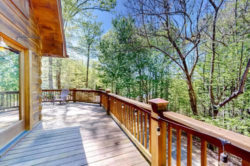 a large wooden deck with a bench on it at Bird's Nest in Saluda