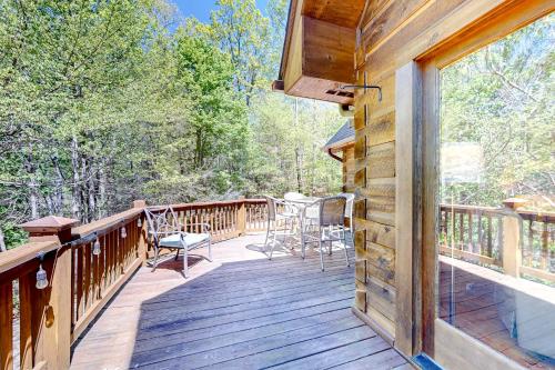 a large deck with chairs and a table on it at Bird's Nest in Saluda