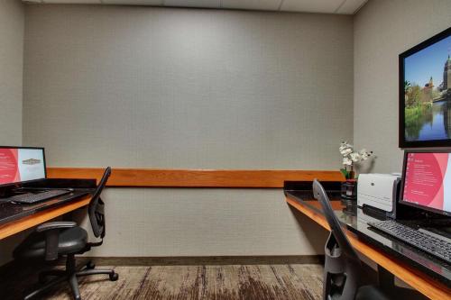 an office with two desks with two computers on them at Drury Inn & Suites San Antonio Northwest Medical Center in San Antonio