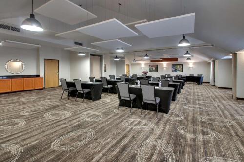 a conference room with chairs and a podium in it at Drury Inn & Suites San Antonio Northwest Medical Center in San Antonio